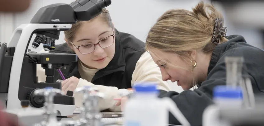 Two students working in a science lab